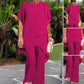 Completo composto da affascinante top irregolare e pantaloni a gamba larga