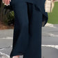 Completo composto da affascinante top irregolare e pantaloni a gamba larga