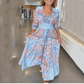 Abito lungo elegante con stampa floreale e cordoncino da donna